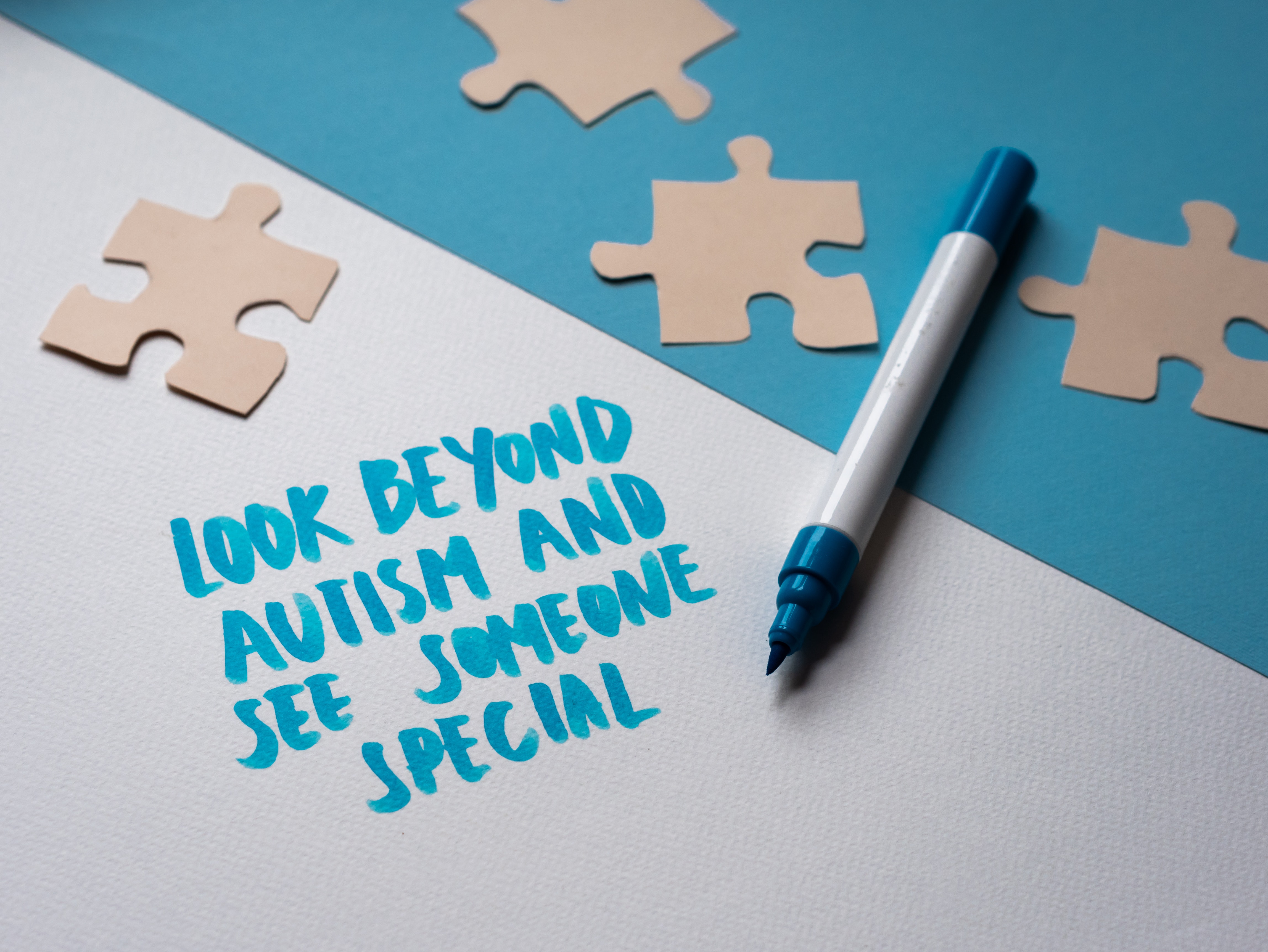 A decorative image with the text "look beyond autism and see someone special"